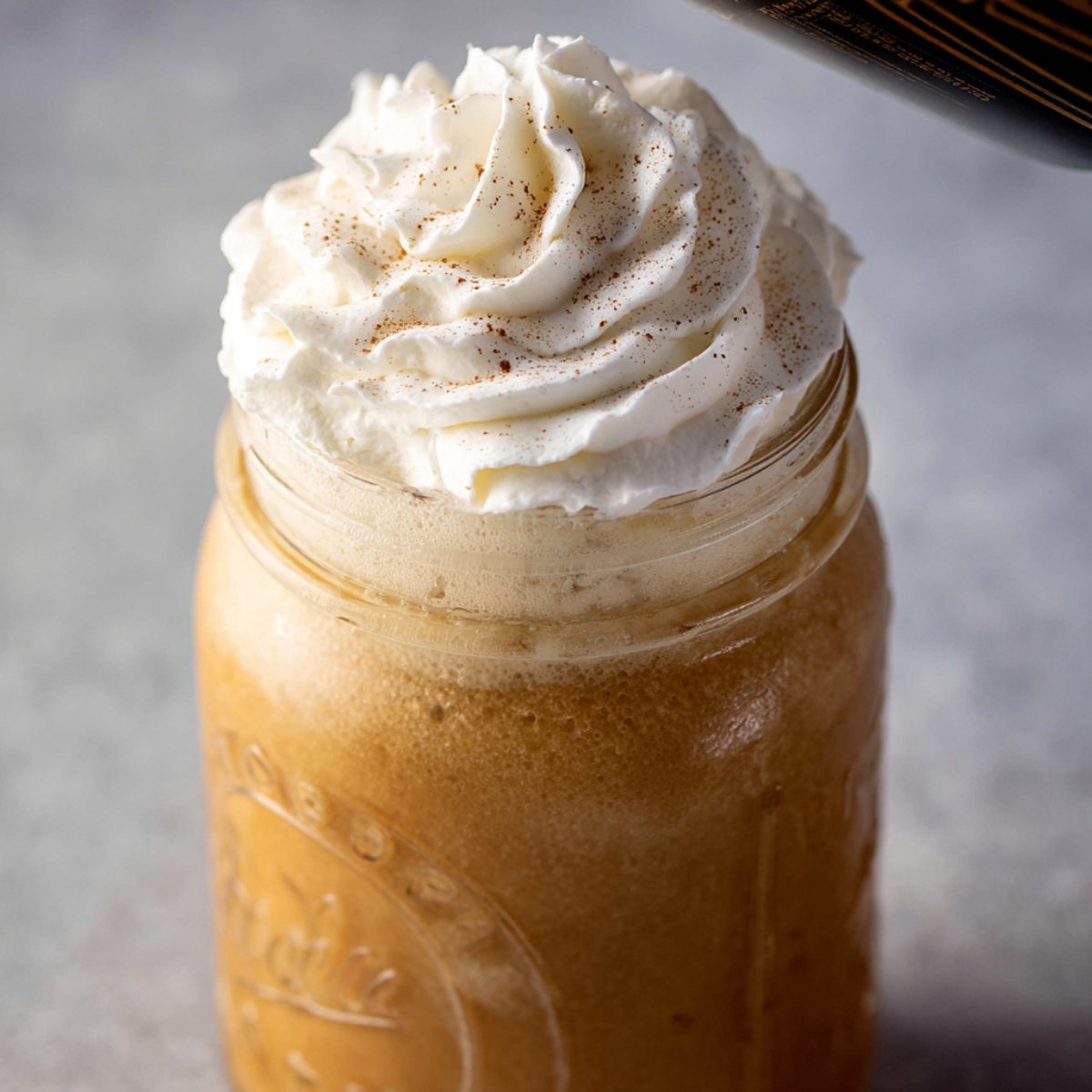 Swirl some whipped cream on top, add a cinnamon stick for stirring, and dust with an extra pinch of pumpkin spice. This step is totally optional but makes it feel extra special.