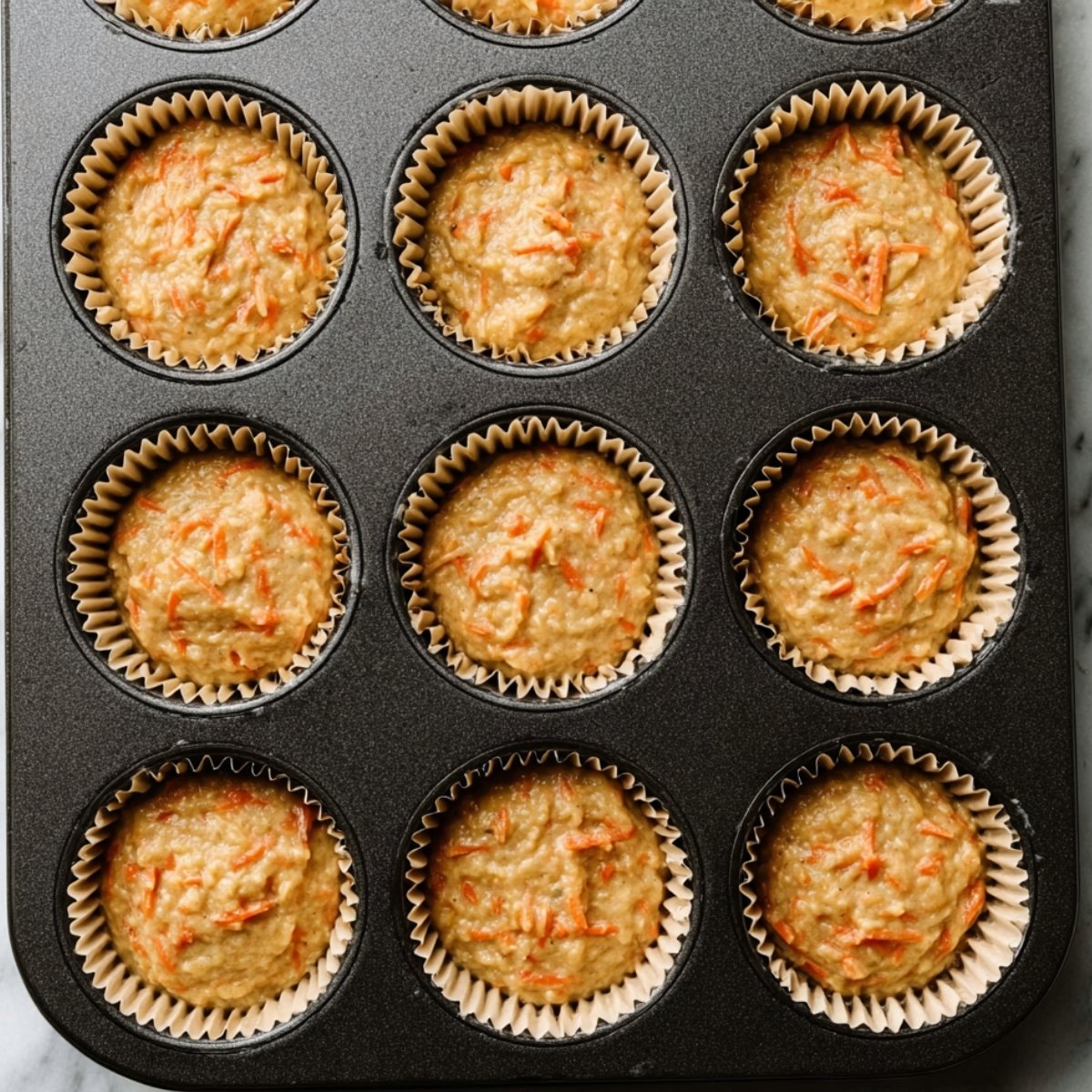 Spoon or scoop the batter into the prepared liners, filling each about three-quarters full. This prevents overflow and gives you perfectly domed cupcakes.