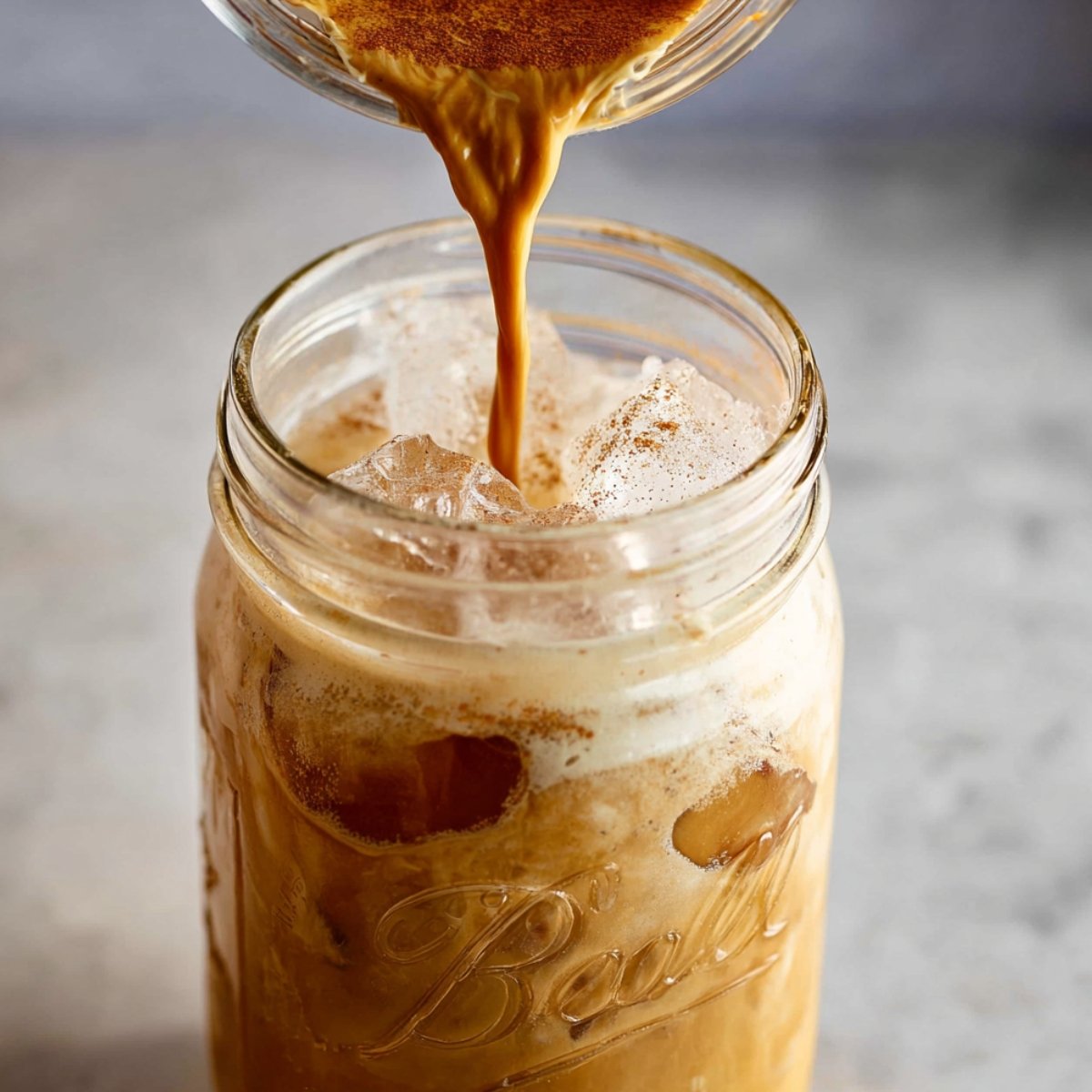 Fill a tall glass with ice cubes, then pour your blended latte right over the top. The drink stays cold and refreshing this way.