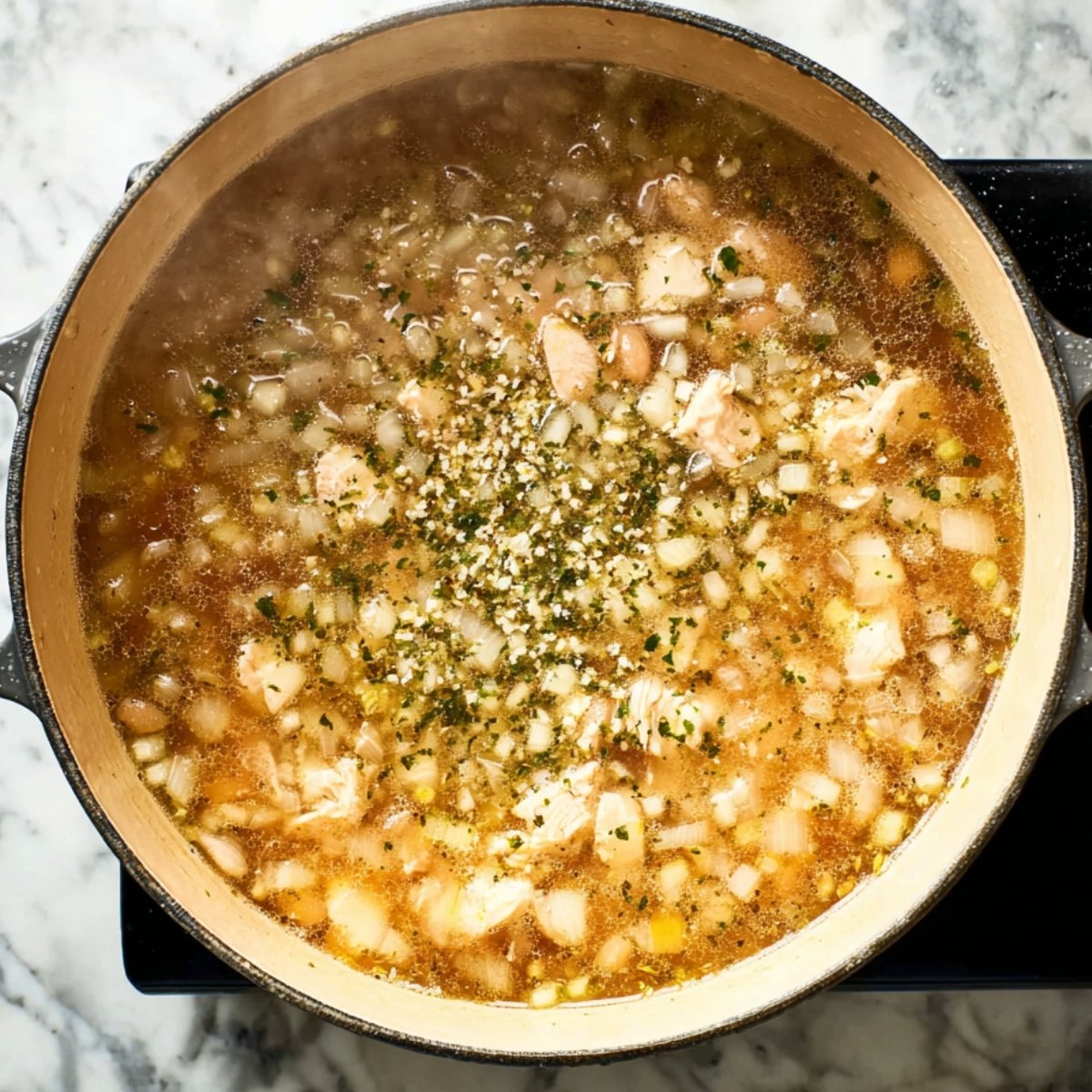 Add the pureed beans, remaining whole beans, and corn to the pot. Bring everything to a gentle simmer, then let it cook uncovered for 20 to 25 minutes. The flavors will meld together and the broth will thicken slightly.
