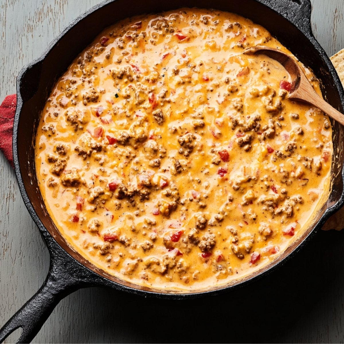 If you're feeling fancy, sprinkle some fresh cilantro, green onions, and diced tomatoes on top. It adds a pop of color and freshness. Serve the dip right away with a big bowl of tortilla chips on the side.